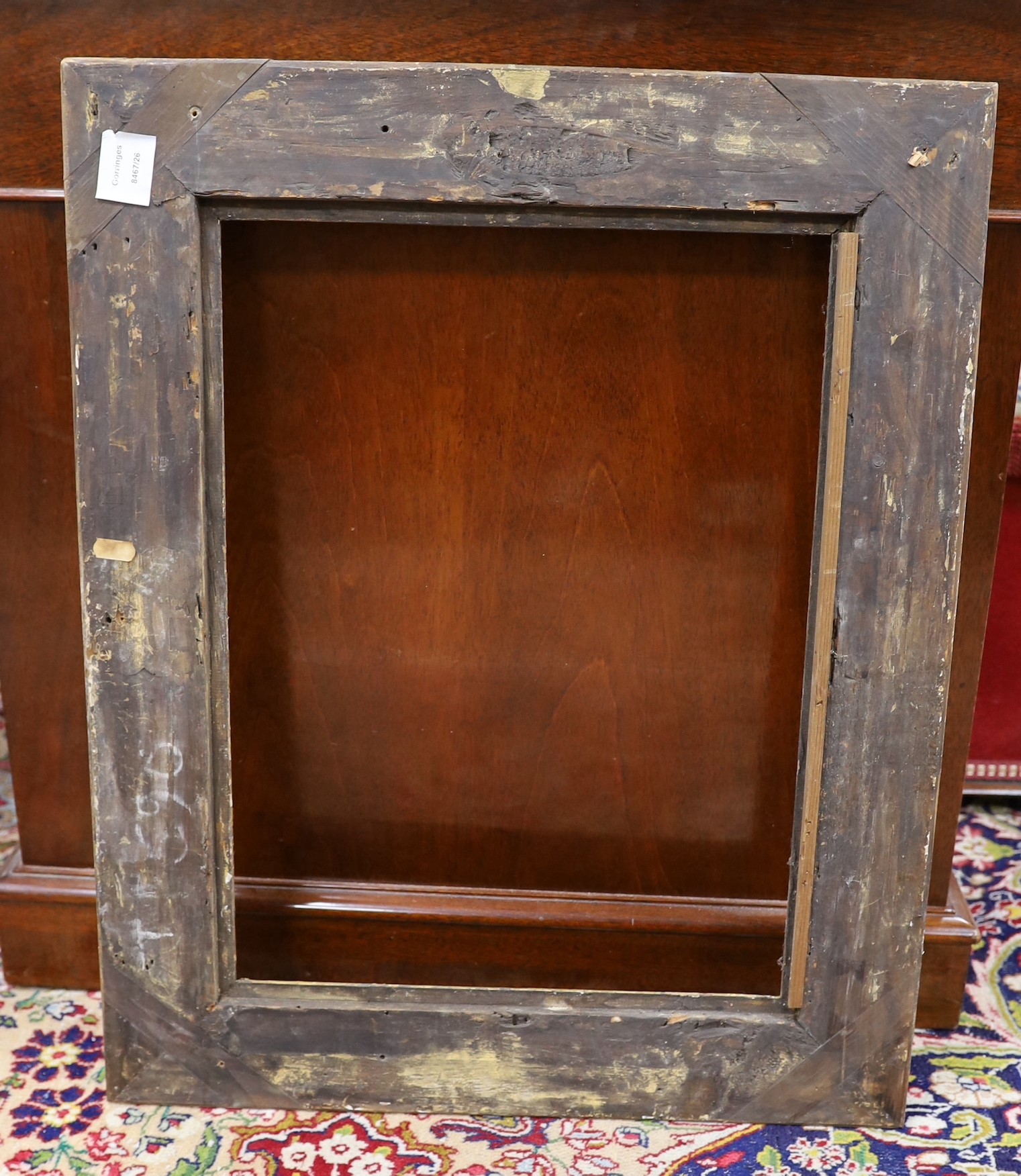 An 18th century French gilt carved wood picture frame, the aperture 51 x 38cm